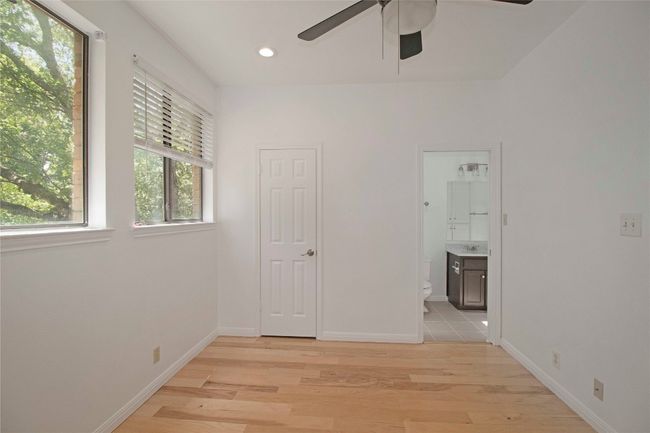 Spacious secondary bedroom with its own en suite bath and walk-in closet. | Image 29