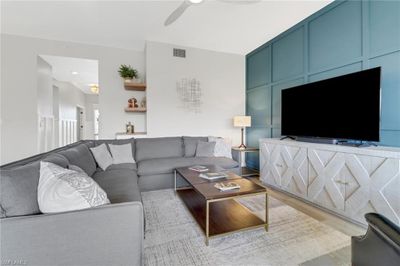 Living room featuring light hardwood / wood-style flooring and ceiling fan | Image 3