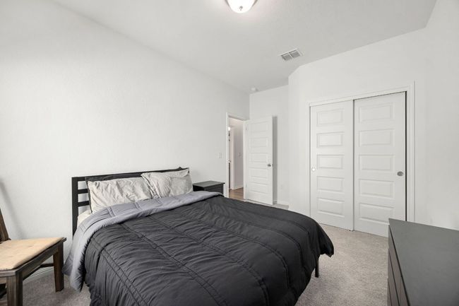 Bedroom featuring carpet and a closet | Image 27