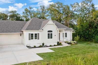 Stucco/stone exterior. 2 car garage. This pic was taken prior to units built on opposite side. | Image 2