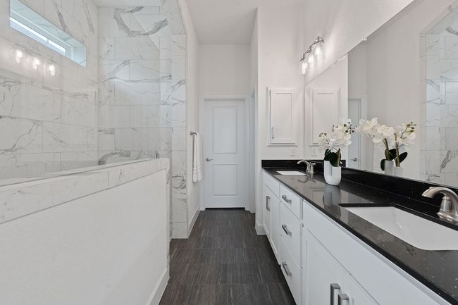 The primary suite also provides a conveniently private toilet and a large walk-in closet. | Image 23