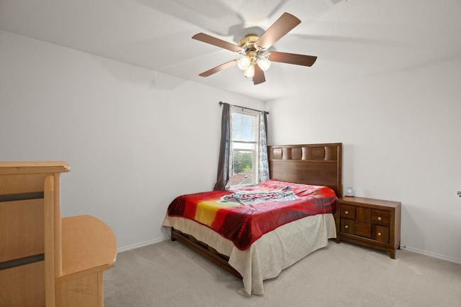 Bedroom featuring carpet floors and ceiling fan | Image 18