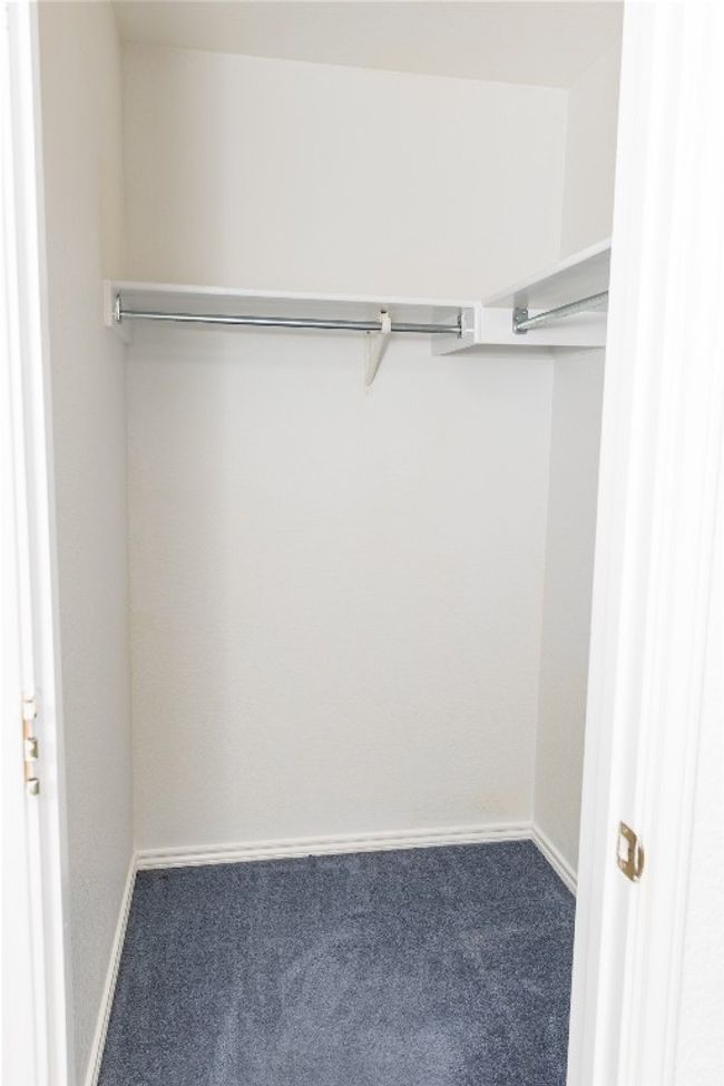 Spacious closet with carpet floors | Image 13