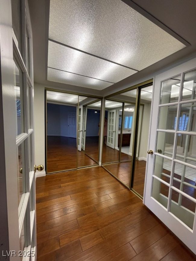 Hallway featuring french doors and hardwood / wood-style floors | Image 26