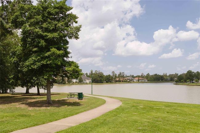 Enjoy top-rated schools and community amenities including miles of walking trails, stocked lakes for canoeing, kayaking, or paddleboarding, and a clubhouse with a resort-style pool, splash pad, and fitness center. Sports lovers will enjoy the pickleball, tennis, and basketball courts, while families will appreciate picnic areas and playgrounds. | Image 17
