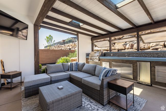 View of patio / terrace with exterior kitchen and an outdoor hangout area | Image 21