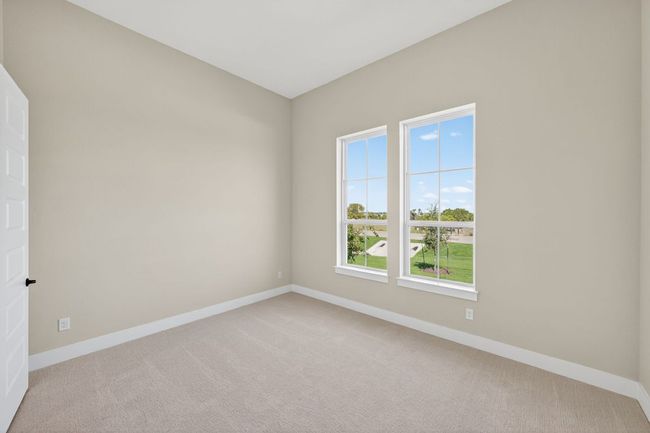 Empty room featuring light colored carpet and baseboards | Image 22