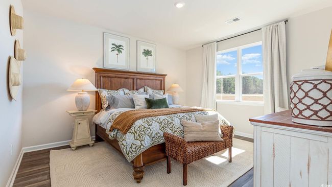 Bedroom featuring visible vents, recessed lighting, baseboards, and wood finished floors | Image 13
