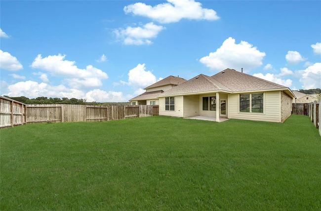A great size backyard and a big covered patio. | Image 8