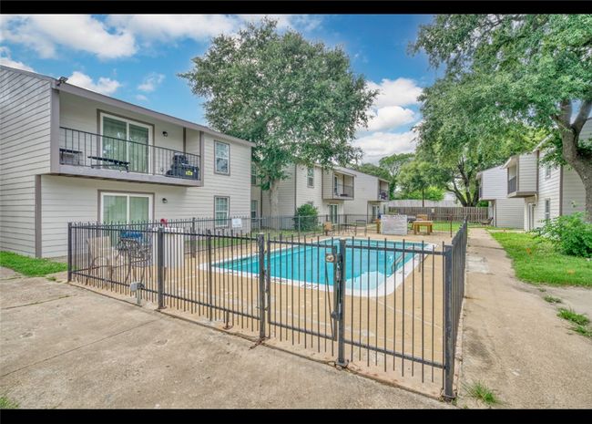 Community pool with a patio area | Image 10