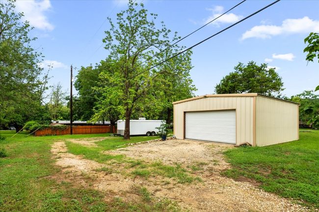 Detached garage featuring dirt driveway | Image 31