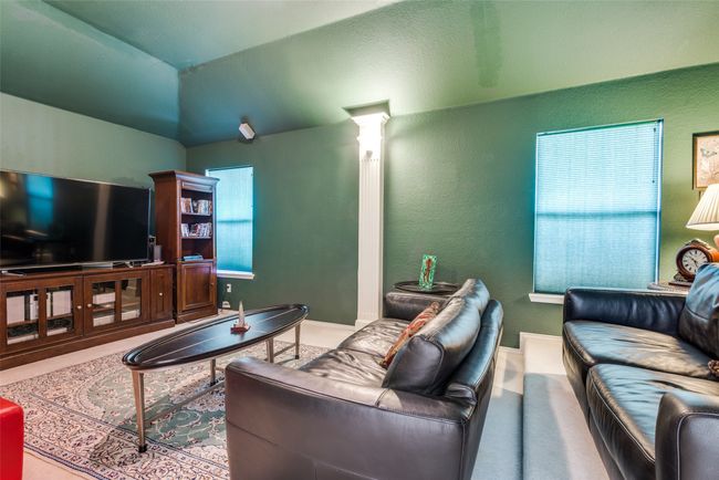 Large media room is located upstairs | Image 19