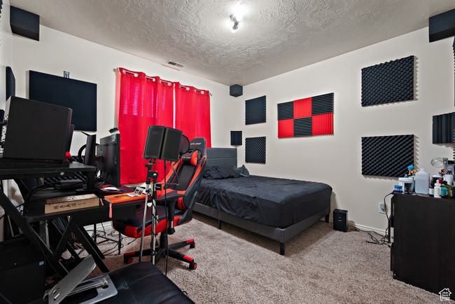 Bedroom with carpet flooring and a textured ceiling | Image 41