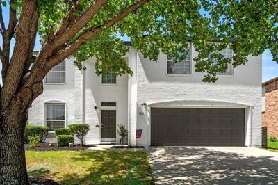 View of front of property featuring a garage | Image 1