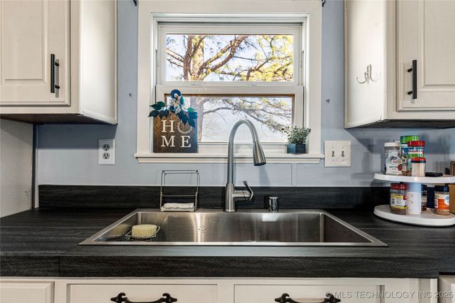 New farmhouse sink and faucet. Kitchen window overlooks back yard | Image 20