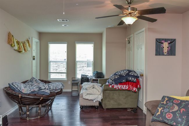 Living area with ceiling fan and hardwood / wood-style floors | Image 9
