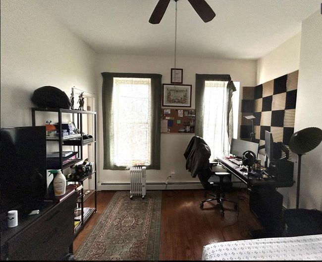 Home office with a ceiling fan, wood finished floors, and a wealth of natural light | Image 5