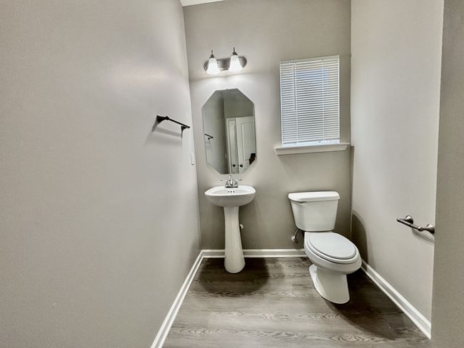 The half bath downstairs is by a Office or Rec Room. Could be used as a bedroom if needed (no closet) | Image 6