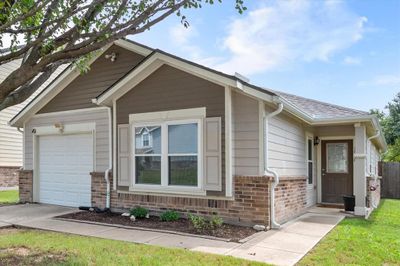 View of front of house featuring a garage | Image 1