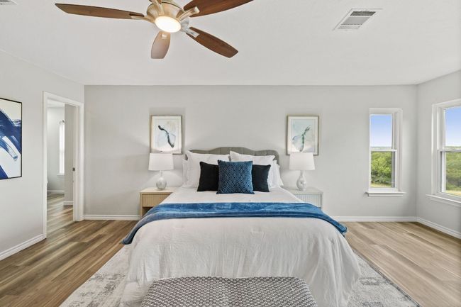 Bedroom with wood finished floors, baseboards, and ceiling fan | Image 30