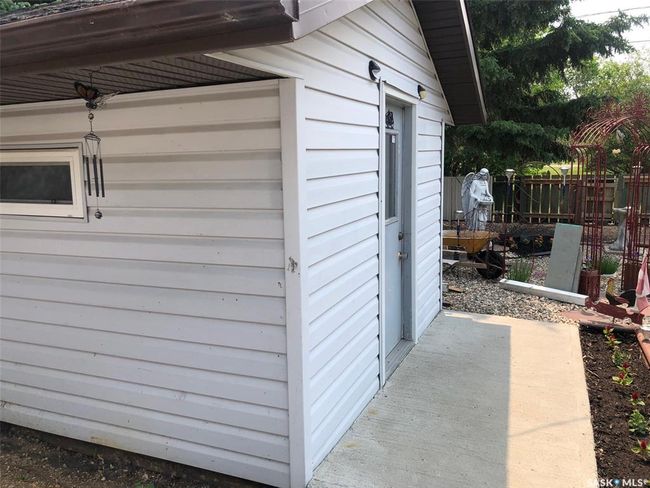 View of side of home with an outbuilding | Image 10