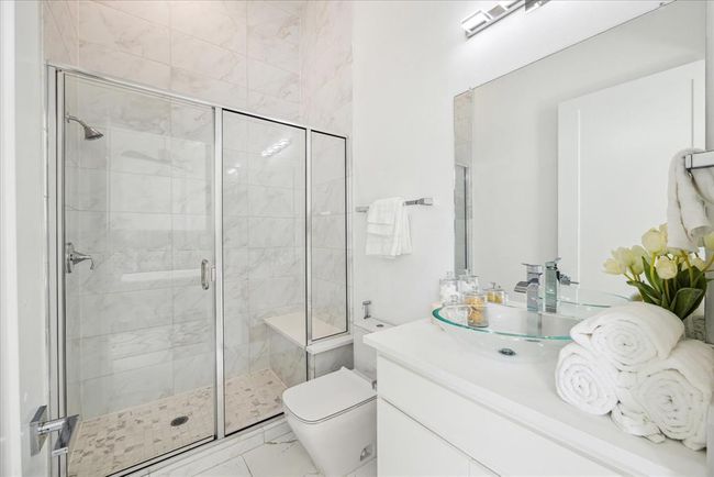 GUEST BATHROOM: A private en-suite bathroom ensures convenience and luxury, equipped with modern fixtures and a stylish design! | Image 21