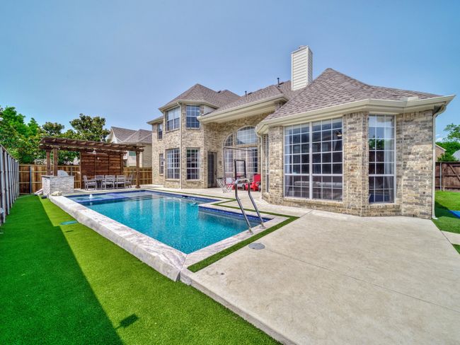 View of pool featuring a pergola and a patio area | Image 30
