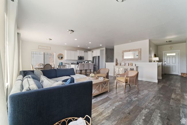 Living area featuring dark wood-style floors and recessed lighting | Image 6