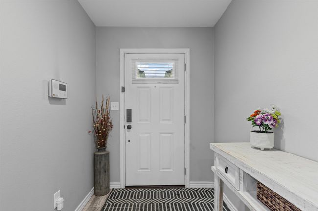 Doorway featuring baseboards | Image 4
