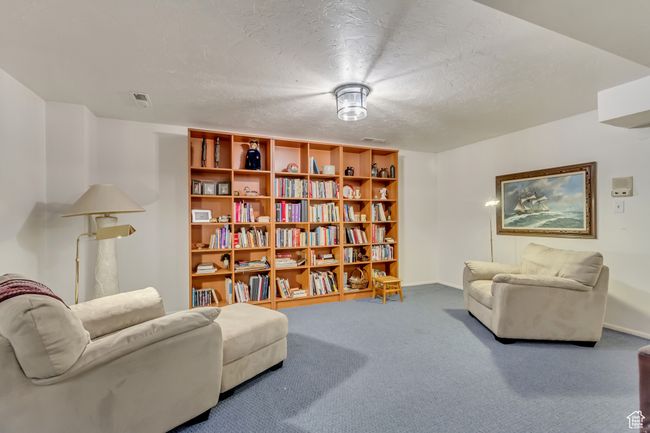 Living area with visible vents, baseboards, carpet, and a textured ceiling | Image 26