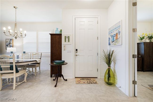 Entryway featuring a chandelier | Image 8
