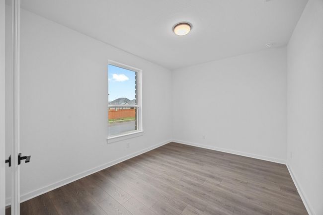 Unfurnished room with wood finished floors and baseboards | Image 15