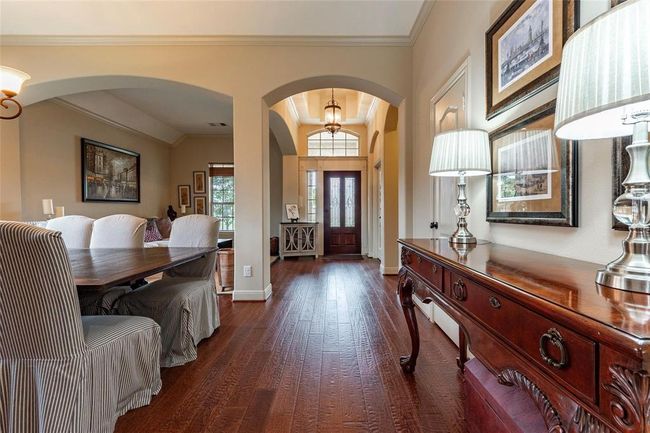 Entryway opens up to the formal living room and dining area. | Image 13