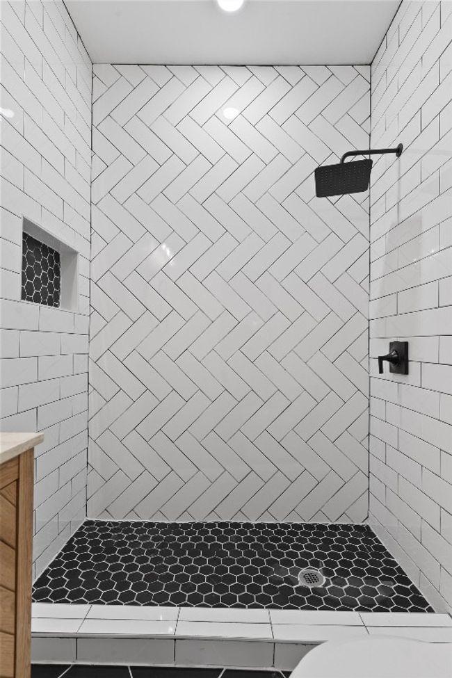 Bathroom featuring tiled shower | Image 14
