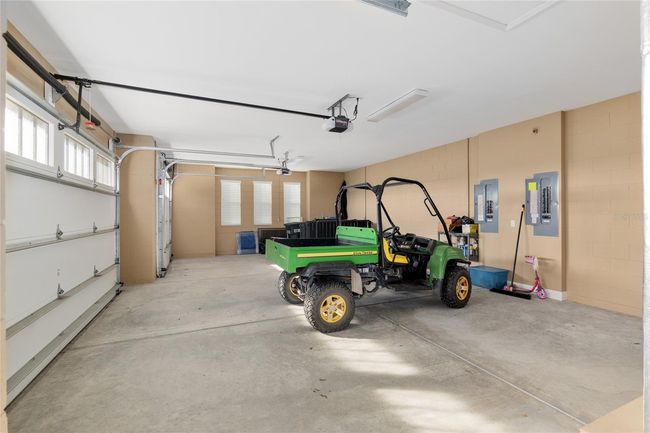 Two car garage with golf cart garage | Image 55