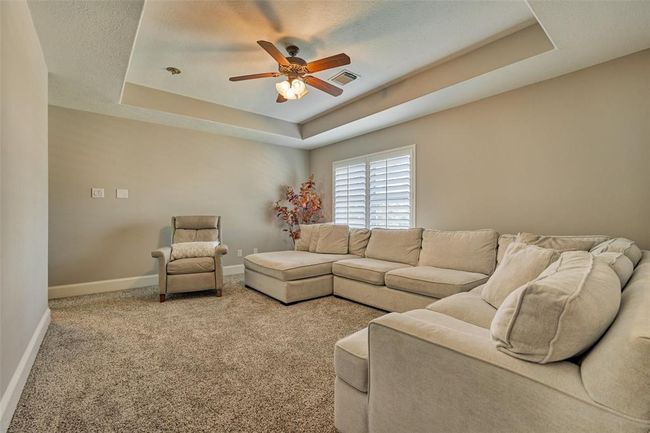Versatile flex room perfect for a playroom, TV area, or cozy lounge. | Image 22