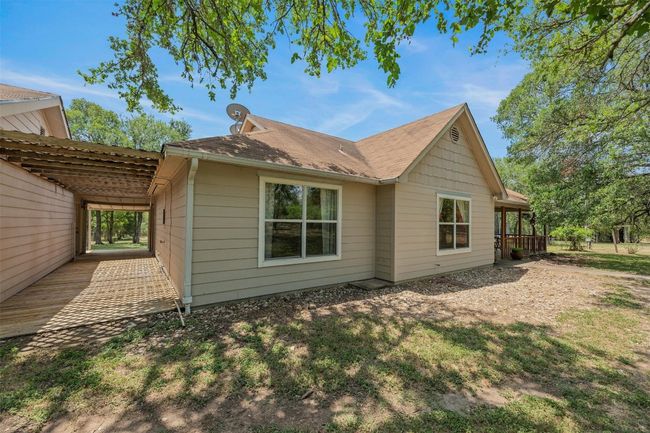 Walkway between house and workshop. | Image 9