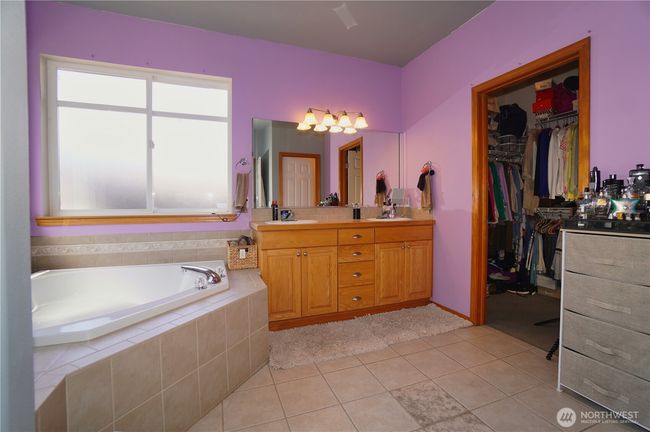 Primary bath, double vanity, soaking tub & walk in closet | Image 18