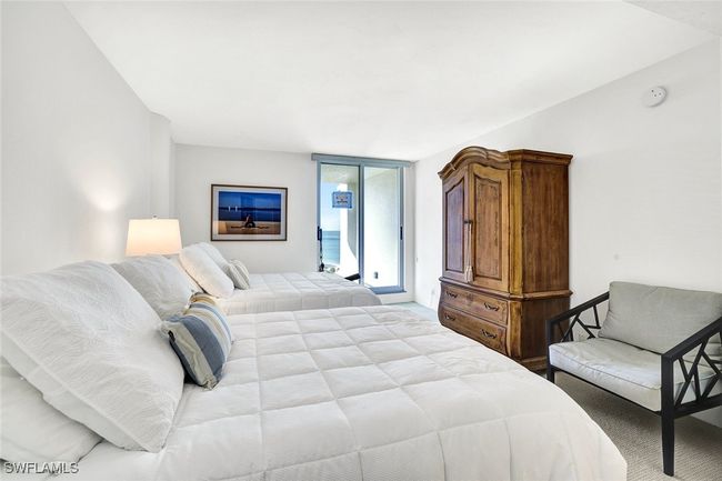 Carpeted bedroom with access to outside | Image 24