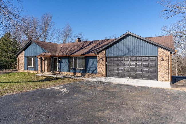 View of front of property featuring a garage | Image 11