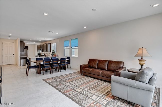 Living area with recessed lighting and light tile patterned flooring | Image 5