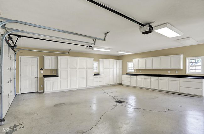2 CAR ATTACHED GARAGE WITH EPOXY FLOORING AND STORAGE | Image 43