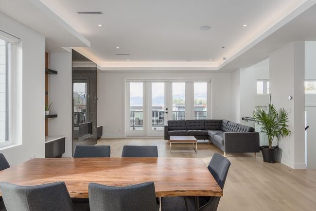 Dining space with recessed lighting, light wood-style flooring, baseboards, and a tray ceiling | Image 10
