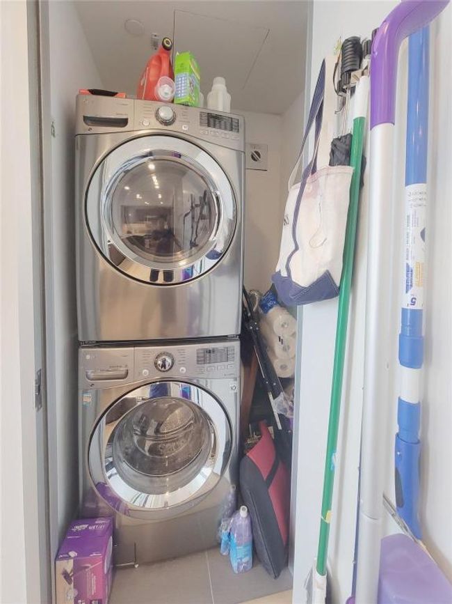 Laundry room with stacked washer / drying machine | Image 10