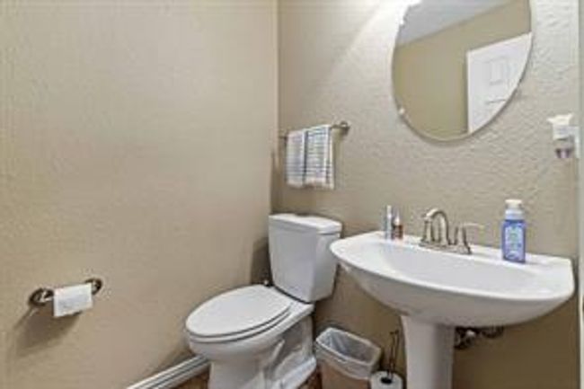 Half bath featuring toilet and a textured wall | Image 8