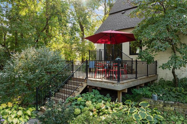 Expansive deck overlooks private, wooded and fenced back yard | Image 36