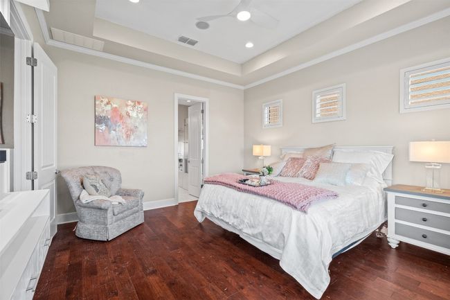 Privately situated at the rear of the home, the expansive primary suite is a true retreat. | Image 15
