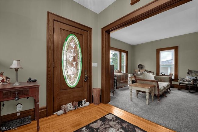 Foyer entrance with a wealth of natural light and wood finished floors | Image 4