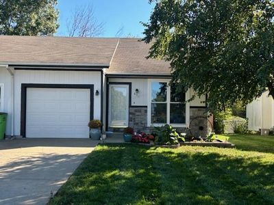 View of front of home with a garage and a front yard | Image 1