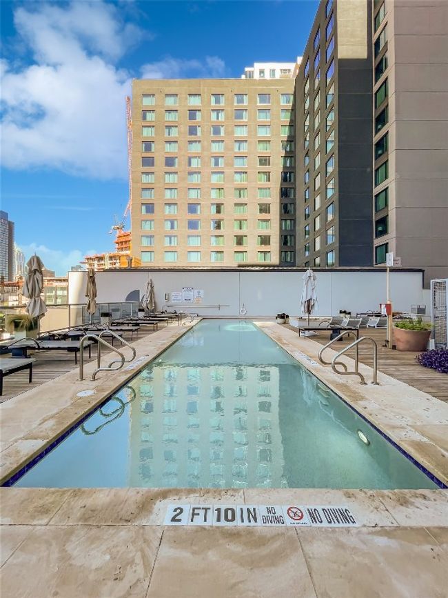 Community pool with a patio | Image 27